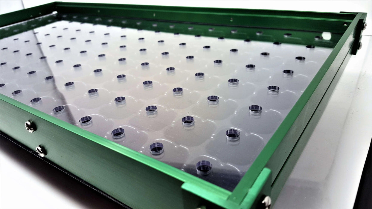 Green anodized aluminum tray with clear plastic base, featuring a grid of dark circular inserts. Ideal for organizing small parts.
