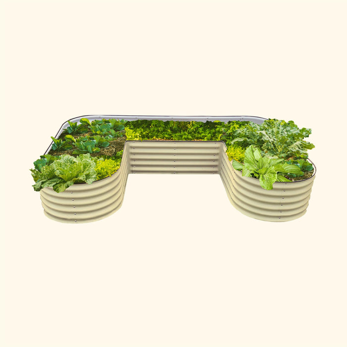 U-shaped corrugated metal raised garden bed with various green vegetables: kale, lettuce, cabbage, bok choy.