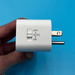 White electrical outlet timer plug with OFF AUTO ON toggle switch. Photoelectric sensor for automatic lighting control.