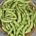 Fresh green edamame pods in a bowl. Healthy plant-based snack, protein-rich soybeans, vegan food.