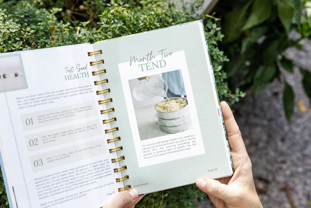 Gardening planner open to seed health test and 'Month Two Tend' pages. Features sprout germination guide and watering seedlings.