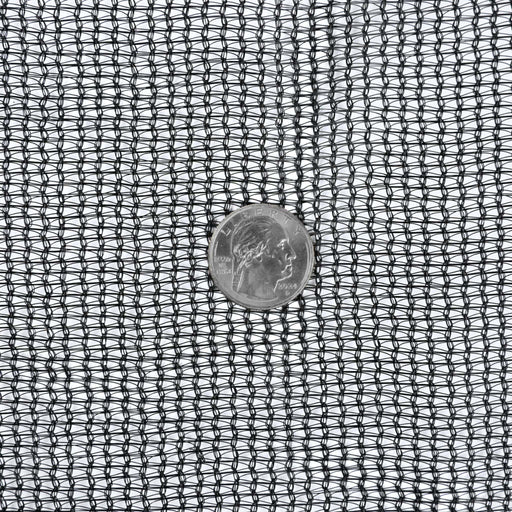 Black mesh shade cloth fabric with a US quarter for scale. Ideal garden netting, greenhouse material, or crop protection.
