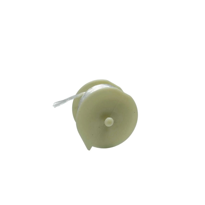 Light beige plastic fishing line spool with clear monofilament line and small center peg.