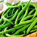 Fresh vibrant green beans in a wicker basket. Healthy garden produce, organic vegetables.