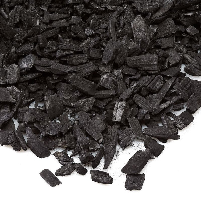Natural lump charcoal for grilling, BBQ, and smoking. Dark wood pieces, ideal cooking fuel.