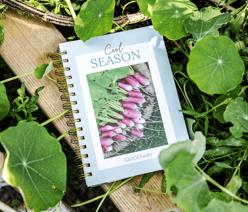 "Cool Season" Gardenary planner, featuring radishes, on wood in a garden. Perfect for cool season planting & growing.