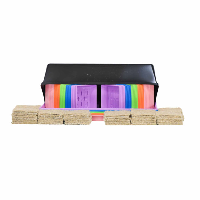 Colorful plastic seedling pots and brown coco coir grow mats in a black tray. Complete seed starting kit for gardening.