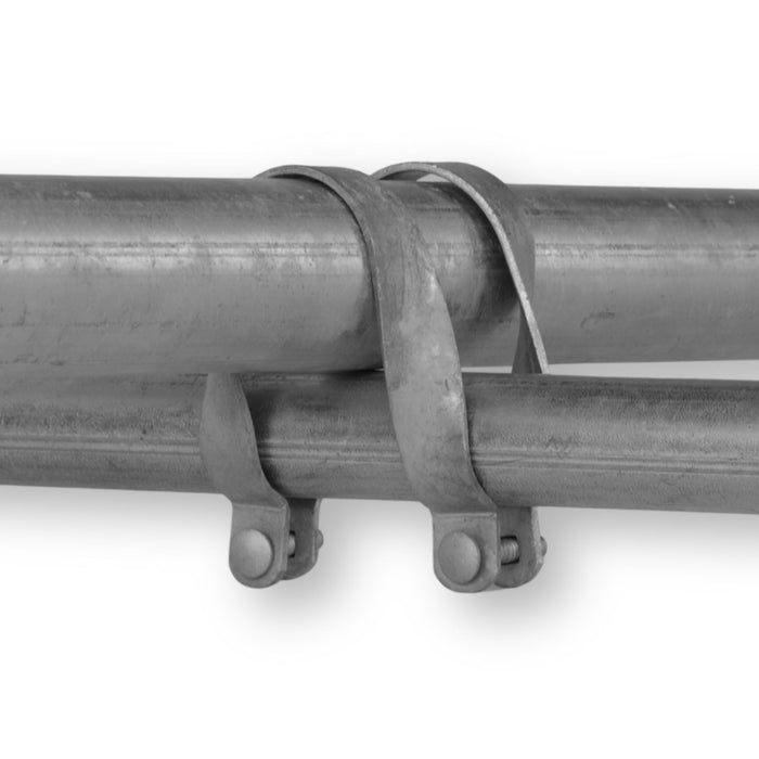 Two galvanized steel conduits fastened together by two-hole pipe clamps.
