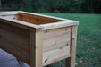 Natural cedar raised planter box, empty and ready for outdoor gardening, herbs, or vegetables.