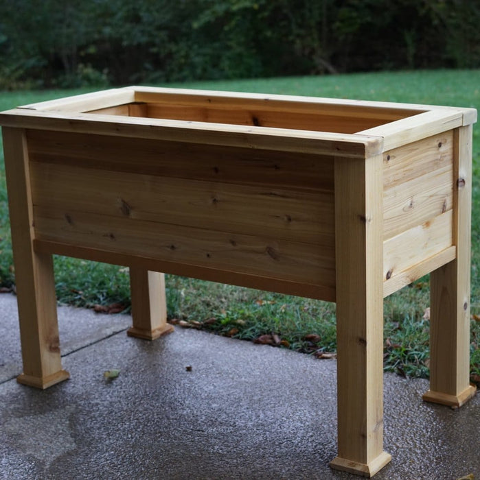 Cedar raised garden bed on legs. Elevated wooden planter box for outdoor patio gardening, herbs, and flowers.