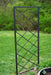 Black metal garden trellis featuring a diagonal grid design, ideal for climbing plants in a lush backyard.