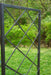 Dark grey metal garden trellis with diagonal grid pattern, ideal for climbing plants or outdoor decor.