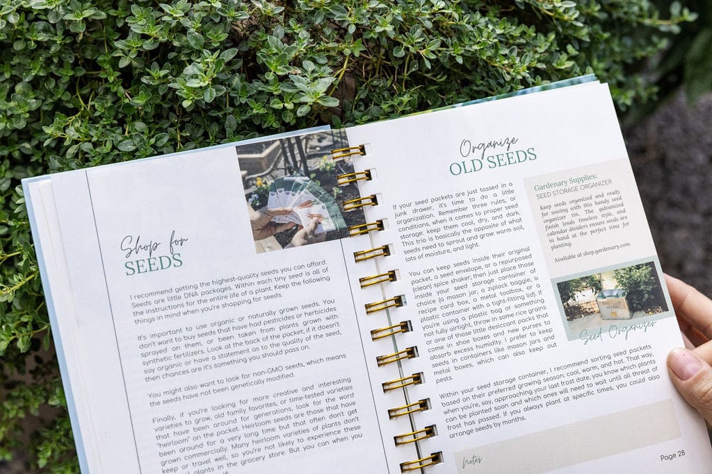 Gardening journal open to seed selection & storage tips. Pages titled "Shop for Seeds" & "Organize Old Seeds." Green plant background.