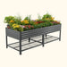 Elevated dark gray metal raised garden bed filled with vibrant flowers and plants, featuring a convenient storage shelf.