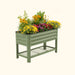 Corrugated green metal raised garden bed with colorful flowers and bottom storage shelf for patio gardening.