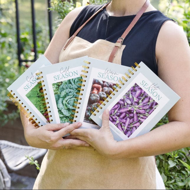 Four seasonal garden planners: Cool, Cold, Warm, Hot. Covers show kale, peppers, eggplant. Perfect for garden planning.