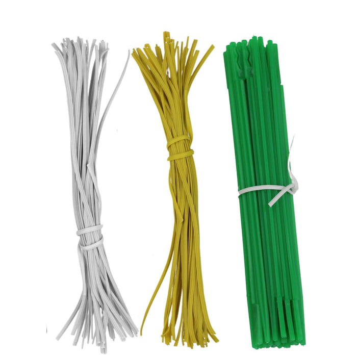 White, yellow, and green plastic garden ties. Flexible plant ties and reusable support straps.