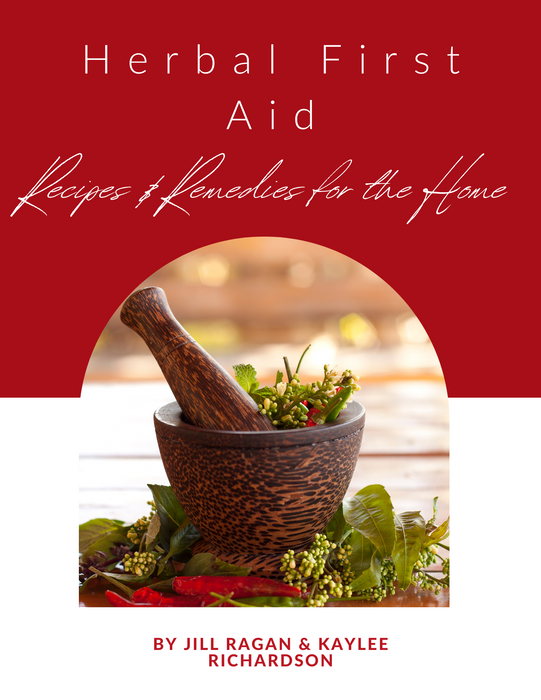 Herbal First Aid Recipes & Remedies for the Home book cover. Mortar, pestle, fresh herbs, berries, chilies.