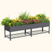 Dark grey corrugated galvanized steel raised garden bed planter with colorful flowers and lower storage shelf.
