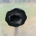 Damaged black threaded bulkhead fitting, torn internal seal. Plastic water tank part, repair or replacement needed.