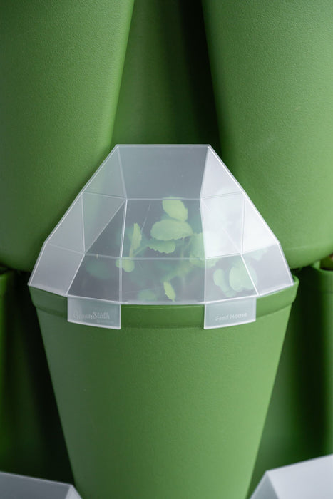 GreenStalk Seed House cover on a vertical garden planter with seedlings for germination.