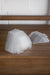 Stacked GreenStalk garden translucent plastic plant covers on wood. Dome-shaped seed starters for vertical gardens.