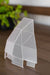 Translucent geometric "Seed House" seed starter cover on a wooden surface for plant germination.