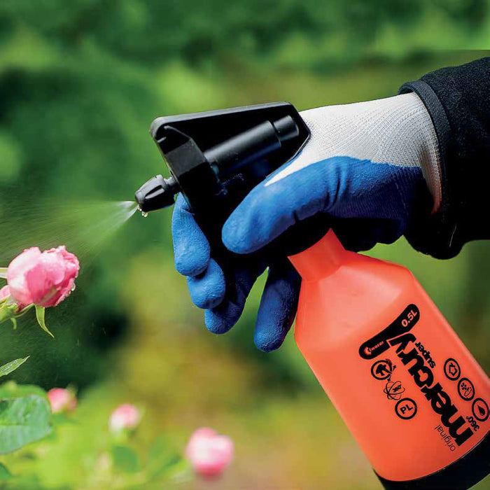 Blue-gloved hand sprays pink rose with orange 0.5L Super Mercury garden sprayer for plant care.