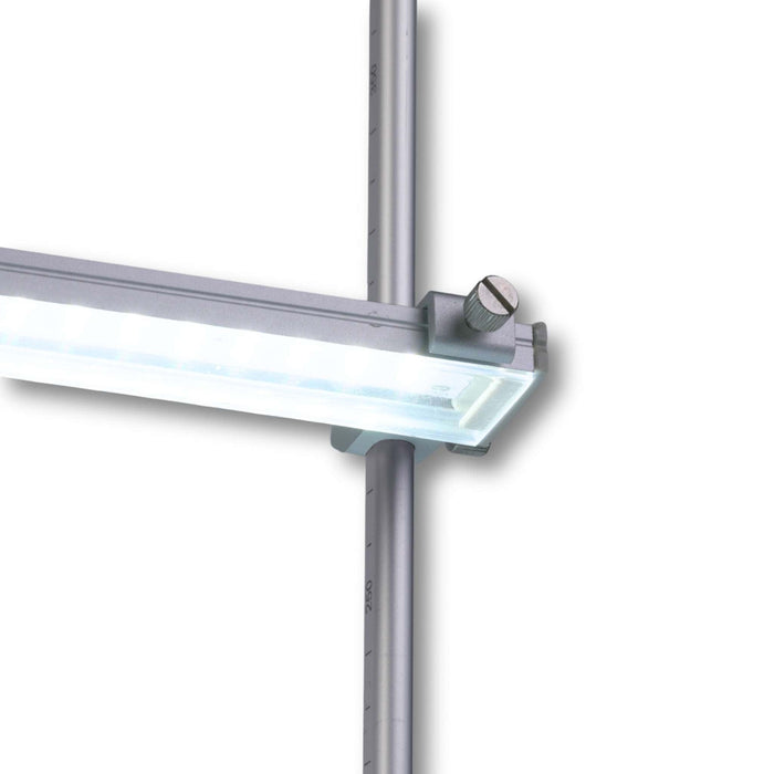 Linear LED light fixture with aluminum housing, clamped to a vertical metal pole with measurement markings.