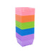 Stacked square plastic seedling pots in pink, orange, green, blue, purple. Colorful gardening planters for propagation.