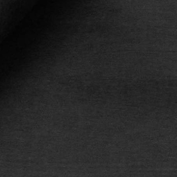 Dark charcoal grey textured fabric background, matte textile material with subtle weave.