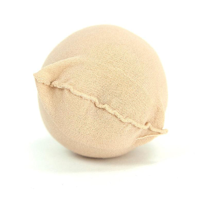 Nude beige rounded bra pad insert, soft fabric with stitched edge, ideal for lingerie, swimwear, or dresses.