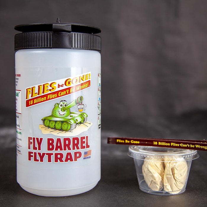 Fly Barrel Flytrap bottle, 'Flies Be Gone' bait packets, and stir stick for outdoor pest control. Effective fly killer.