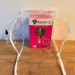 Fungi Friends Pink Oyster Mushroom Growing Kit with clear humidity tent and spray bottle on wood table.