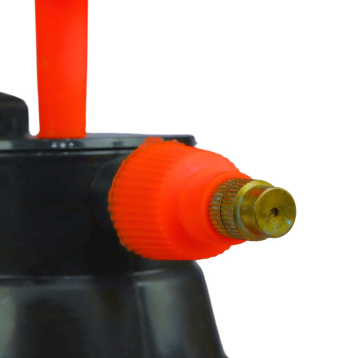 Adjustable orange sprayer nozzle with brass tip on a black pump sprayer. Perfect for gardening, plant misting, and cleaning.