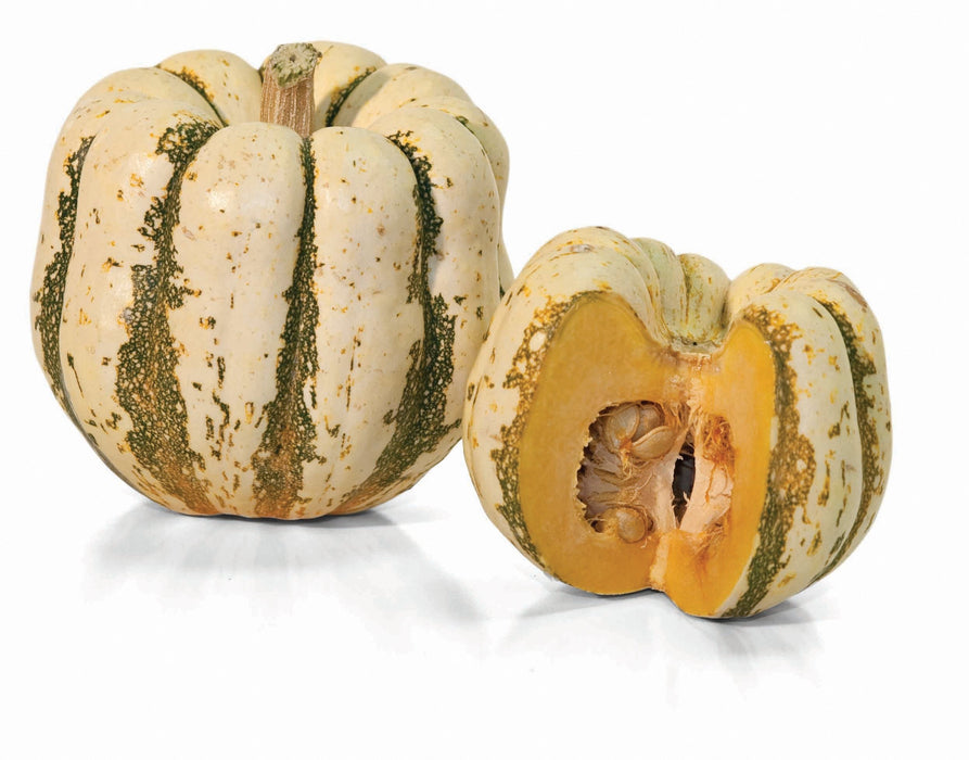 Cream and green striped sweet dumpling squash, one whole, one halved showing orange flesh and seeds.