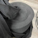 Black mesh fabric roll, durable woven textile for industrial use.