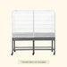 Mobile metal garden stand with white mesh greenhouse cover, zippered front, and lower wire shelf on casters.