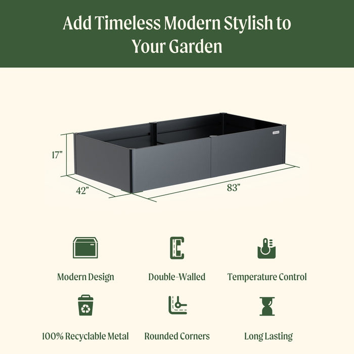 Modern dark grey metal raised garden bed, 17"H x 42"W x 83"L. Double-walled, recyclable, durable planter for gardening.