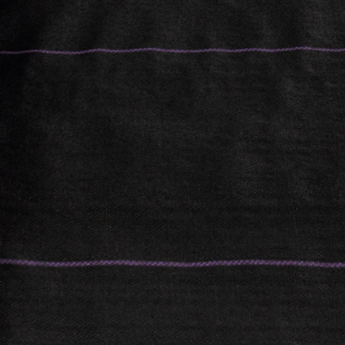 Black landscape fabric with two purple guide lines for precise planting rows and effective weed control.