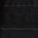 Black landscape fabric with two purple guide lines for precise planting rows and effective weed control.