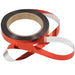 Red metallic ribbon on a spool with a shiny, reflective surface. Ideal for gift wrapping, crafts, and party decor.