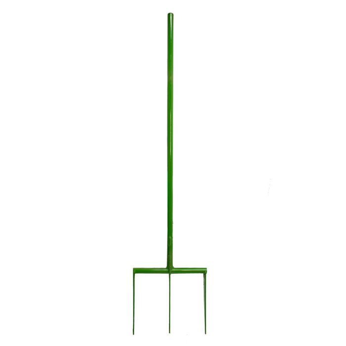 Green three-prong spading fork. Garden tool for digging, cultivating soil, and aerating.