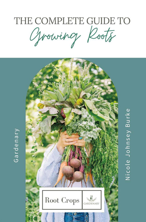 Gardener holds fresh beets, carrots, kale, leafy greens. "Growing Roots" guide by Gardenary.