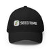 Black Seedtime baseball cap with embroidered logo: white text and green sprout. Gardening hat.