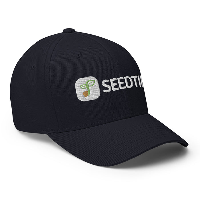 Navy baseball cap with embroidered Seedtime sprout logo.