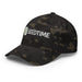 Dark camouflage baseball cap with white embroidered Seedtime logo featuring a green sprouting seed.