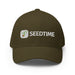 Olive green Seedtime baseball cap with plant sprout logo, perfect for gardening.