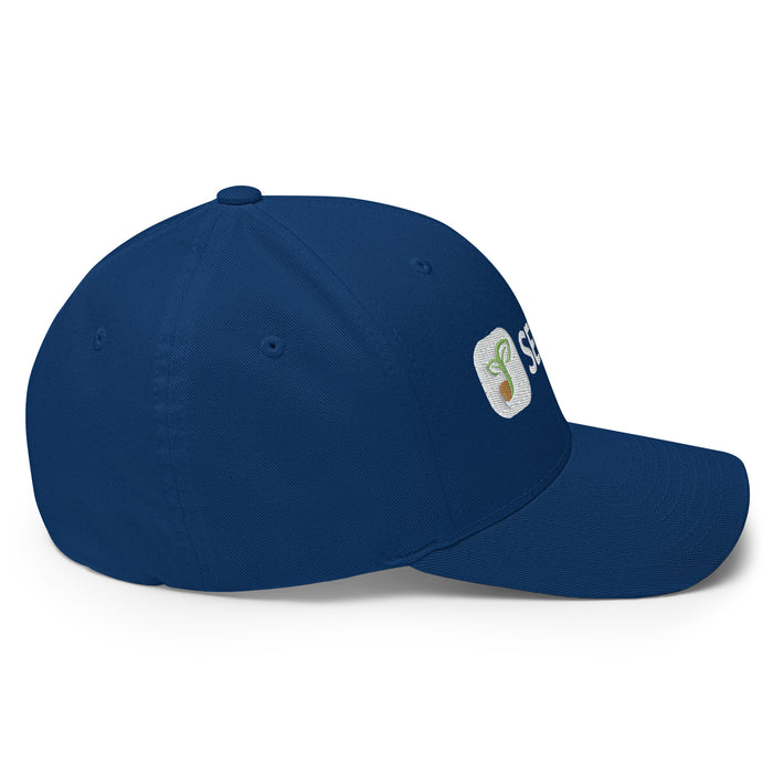 Navy blue baseball cap with embroidered white logo: green sprout, brown seed. Plant-themed headwear.