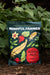 Mindful Farmer Feather Meal 12-0-0 organic fertilizer bag (5lb) with feather & beet art in garden soil.